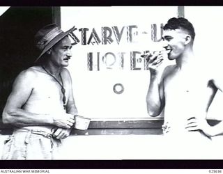 PORT MORESBY, PAPUA, 1942-07. AUSTRALIAN "DIGGER" HUMOUR CHANGED THE NAME OF THIS NEW GUINEA HOTEL FROM "STARVIEW" TO "STARV-U", BUT THERE IS NOT MUCH SIGN OF HUNGER IN THIS PICTURE