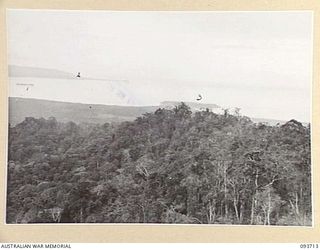 WEWAK AREA, NEW GUINEA, 1945-06-28. THE VIEW FROM MOUNT SHIBURANGU LOOKING NORTH EAST AND SHOWING RABOIN ISLAND (1), KAIRIRU AND MUSCHU ISLANDS (2) AND WEWAK POINT (3). THE AREA HAS BEEN CAPTURED ..