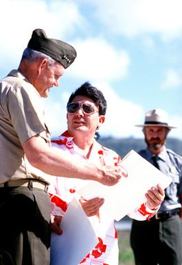 General Louis H. Wilson, Commandant of the Marine Corps, speaks with Paul M. Calvo, Governor of Guam, during a ceremony conducted as work begins on the War in the Pacific National Park