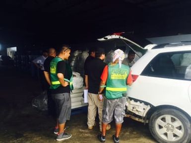 SAIPAN - Commonwealth of Northern Mariana Islands (CNMI) Community Emergency response Teams (CERT) help distribute tents, provided by FEMA, to survivors. Photo by Ryan Brown.