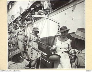 1942-11-11. AUSTRALIAN NURSES RETURN TO NEW GUINEA. NURSES DISEMBARKING AT NEW GUINEA. AT THE BOTTOM OF THE GANGWAY OF HMT WANGANELLA IS VX111163 LIEUTENANT M. A. CUMMINGS. (PHOTOGRAPHER: GEORGE ..