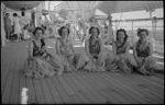 Members of Women's War Service Auxiliary in Hawaiian costume on deck of Maunganui during World War II