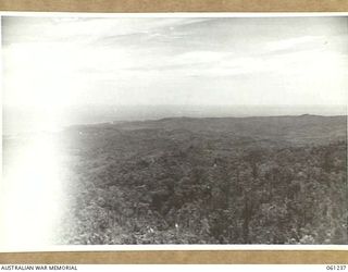 SATTELBERG, NEW GUINEA. 1943-11-29. GENERAL VIEW OF THE AREA SHOWING FINSCHHAFEN HARBOUR IN THE BACKGROUND