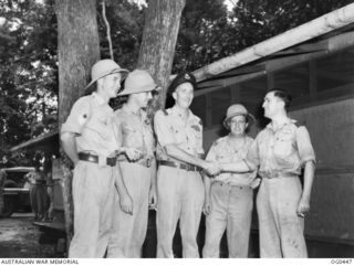 KIRIWINA, TROBRIAND ISLANDS, PAPUA. C. 1943-12. FLIGHT LIEUTENANT R. H. FINLAY AWARDED THE DFC FOR A DARING ATTACK ON A JAPANESE MERCHANT SHIP IN SIMPSON HARBOUR ON THE NIGHT OF 1943-12-04 IS BEING ..