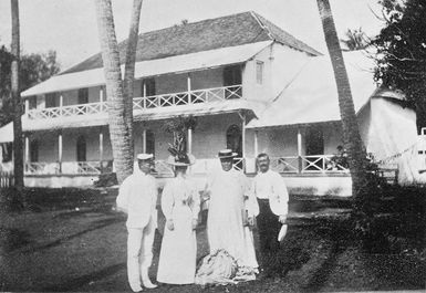 Group of unidentified people in front of palace, Rarotonga