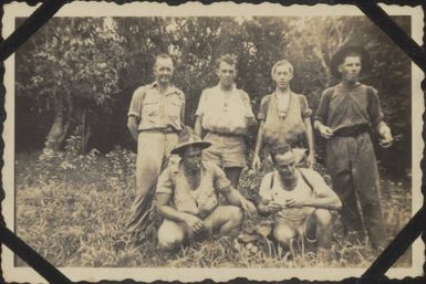 Kiwi soldiers in an organge grove in New Caledonia