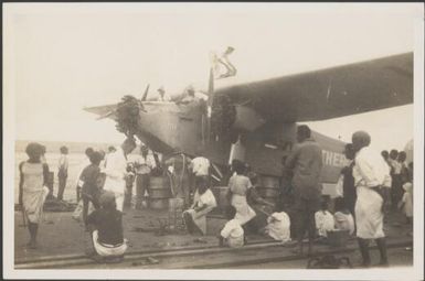 Fijians observing refuelling of The Southern Cross plane at Naselai Beach, Fiji, 7 June 1928