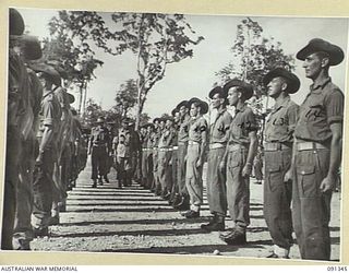 TOROKINA, BOUGAINVILLE. 1945-04-28. MAJOR GENERAL C.H. SIMPSON, SIGNAL OFFICER IN CHIEF (2), INSPECTING A PARADE OF B CORPS SIGNALS, 2 CORPS, DURING HIS VISIT TO BOUGAINVILLE TO INSPECT SIGNAL ..