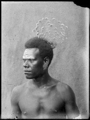Man wearing Goura pigeon feathers, New Guinea, ca. 1929, 1 / Sarah Chinnery
