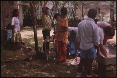 Malaria Control Service national staff prepare an earth oven for a party (1) : Papua New Guinea, 1976-1978 / Terence and Margaret Spencer