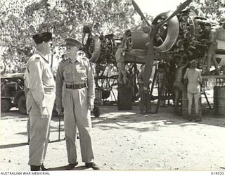 NEW GUINEA: GOVERNOR-GENERAL, LORD GOWRIE, VISITS NEW GUINEA. LORD GOWRIE INSPECTS AUSTRALIAN MANNED AIRCRAFT. WITH HIM IN THIS PICTURE IS SQUADRON LEADER W.T.M. BOLTON OF SYDNEY. EXCLUSIVE TO ..