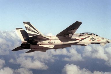 An air-to-air right side view of an F-14A Tomcat aircraft from Fighter Squadron 111 (VF-111)