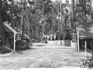 TOROKINA, BOUGAINVILLE ISLAND. 1945-02-04. THE "SHOPPING BLOCK" SOMETIMES KNOWN AS "BOURKE STREET" IN THE CAMP AREA OF THE 58/59TH INFANTRY BATTALION. THE TENTS ARE OCCUPIED BY THE FOLLOWING ..