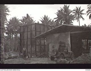 MILNE BAY, NEW GUINEA, 1943-07-11. CONSTRUCTION OF THE ICE WORKS IN PROGRESS AT WAIGANI