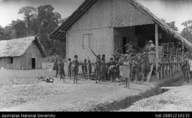 Trading scene at the Atemble Mission house. Father Ziegler at end of verandah. 29  July 1937  12.30 pm dull