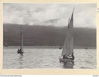 JACQUINOT BAY, NEW BRITAIN. 1945-06-10. YACHTS OF THE ROYAL PACIFIC YACHT CLUB, A CLUB FORMED BY MEN AND OFFICERS IN HEADQUARTERS 5 DIVISION AREA, WHO HAVE BUILT THEIR OWN CRAFT FROM ODDS AND ENDS. ..