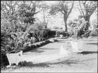 Chinnery's garden with square pots and the harbour in the distance, Malaguna Road, Rabaul, New Guinea, ca. 1936 / Sarah Chinnery