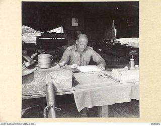 CAPE WOM, WEWAK AREA, NEW GUINEA. 1945-08-30. CAPTAIN A.N. WATSON, COMMANDING OFFICER 2/42 LIGHT AID DETACHMENT, CORPS OF AUSTRALIAN ELECTRICAL AND MECHANICAL ENGINEERS