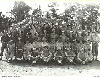 LAE AREA, NEW GUINEA. 1944-11-18. PERSONNEL OF HEADQUARTERS, NO.2 PLATOON, GENERAL ENGINEERING COMPANY, 2/7TH ADVANCED WORKSHOPS. IDENTIFIED PERSONNEL ARE:- NX50180 WARRANT OFFICER I, N.H. COOMBE, ..