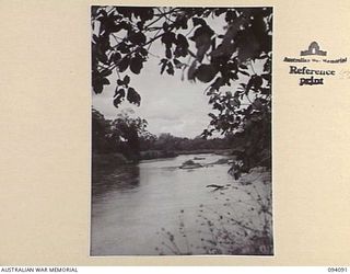 SOPUTA, NEW GUINEA, 1945-06-26. THE RIVER FRONTAGE TO THE SOPUTA WAR CEMETERY. THE CEMETERY IS MAINTAINED BY THE AUSTRALIAN WAR GRAVES SERVICE
