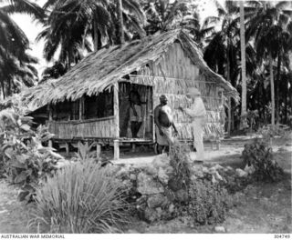 SEGI. NEW GEORGIA, BRITISH SOLOMON ISLANDS PROTECTORATE. AN AMERICAN AEROLOGIST TALKS WITH THE ISLAND'S CHIEF. (NAVAL HISTORICAL COLLECTION)