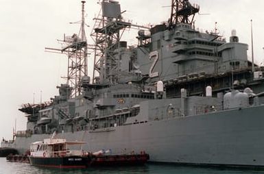 The amphibious assault ship USS SAIPAN (LHA-2) and the nuclear-powered guided missile cruiser USS TRUXTUN (CGN-35) are docked in port. The vessel are in the region in support of maritime interdiction operations