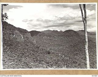 KOKODA TRAIL, NEW GUINEA. 1943-12-19. RUGGED COUNTRY OF THE OWEN STANLEY RANGES WHERE SEQUENCES OF THE FILM "RATS OF TOBRUK" WERE TAKEN BY CHAUVEL'S PRODUCTIONS