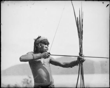 Man aiming a bow and arrow, Ramu River, New Guinea, 1935 / Sarah Chinnery