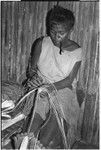 Moruka of Ga'enaafou, 'Elota's daughter, plaiting a bag