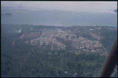 Aerial view of the town of Arawa : Helicopter flight, Bougainville Island, Papua New Guinea, 1971 / Terence and Margaret Spencer