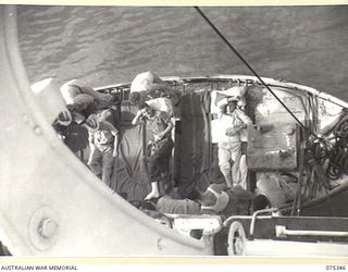 LAE, NEW GUINEA. 1944-08-18. SEAMEN OF 2/1ST HOSPITAL SHIP, "MANUNDA" PREPARING TO HOIST A LIFEBOAT LOADED WITH SICK AND WOUNDED ARMY PERSONNEL ABOARD THE VESSEL