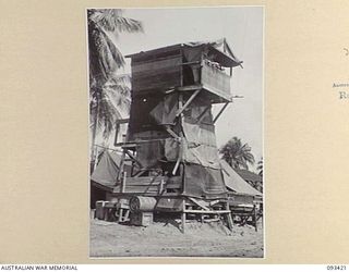AITAPE BEACH HEAD, NEW GUINEA. 1945-06-19. THE CONTROL TOWER MANNED BY MEMBERS OF 7 DOCKS OPERATING COMPANY, ROYAL AUSTRALIAN ENGINEERS, WHICH IS USED TO DIRECT SHIPS INTO PORT BOTH DAY AND NIGHT. ..