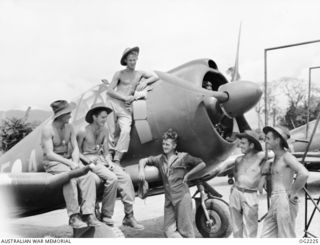 TOROKINA, BOUGAINVILLE ISLAND, SOLOMON ISLANDS. 1945-01-28. MEMBERS OF NO. 5 (TACTICAL RECONNAISSANCE) SQUADRON RAAF ON PIVA AIRFIELD WITH THE TINIEST AIRCRAFT THE RAAF EVER PUT INTO THE AIR, THE ..