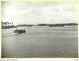 MADANG, NEW GUINEA. 1944-06-27. AMERICAN LIBERTY SHIPS AND LCT'S (LANDING CRAFT TRANSPORT) MOORED IN THE HARBOUR