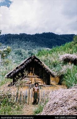 Man standing outside of house