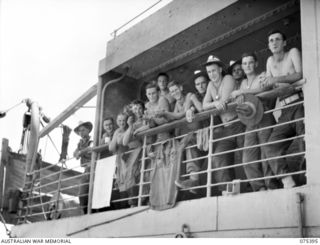 MADANG, NEW GUINEA. 1944-08-19. HAPPY MEMBERS OF THE 4TH INFANTRY BRIGADE ON THE DECK OF HMT "KATOOMBA" IMMEDIATELY PRIOR TO THEIR SAILING FOR THE MAINLAND. IDENTIFIED PERSONNEL ARE:- LANCE ..