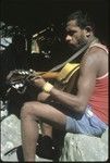 Sale 'Oirukua playing guitar