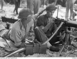 KIRIWINA, TROBRIAND ISLANDS, PAPUA. 1944-01-31. IN MODERN WARFARE, AERODROME DEFENCE IS VITAL AND THE RAAF HAS TRAINED A NUMBER OF "TOUGH GUYS" TO LOOK AFTER ITS POSSESSIONS. 12848 CORPORAL A. W. ..