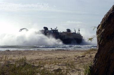 A US Navy (USN) Landing Craft Air-Cushion (LCAC) craft make its way ashore a beach at Bellows Air Force Station (AFS), Hawaii (HI), during an amphibious assault training during Exercise Rim of the Pacific (RIMPAC) 2006. The exercise designed to increase the tactical proficiency of participating units in a wide array of combined sea operations. RIMPAC 2006 brings together military forces from Australia (AUS), Canada (CAN), Chile (CHL), Peru (PER), Japan (JPN), the Republic of Korea (KOR), United Kingdom (UK) and the United States (US)