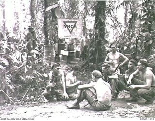 THE SOLOMON ISLANDS, 1945-04-24/27. AUSTRALIAN SERVICEMEN TAKING ADVANTAGE OF YMCA HOSPITALITY IN THE JUNGLE ON BOUGAINVILLE ISLAND. (RNZAF OFFICIAL PHOTOGRAPH.)