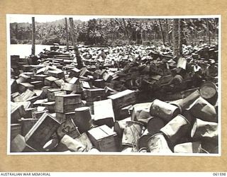 FINSCHHAFEN, NEW GUINEA. 1943-11-20. GENERAL VIEW OF THE STORES PILED HIGH ON THE BEACH