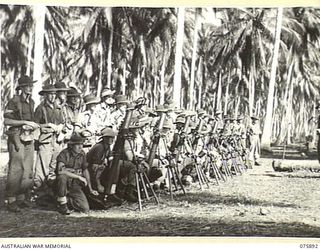 POTSDAM, NEW GUINEA. 1944-09-05. TROOPS OF HEADQUARTERS, 25TH INFANTRY BATTALION ATTENDING A REFRESHER MORTAR SCHOOL IN THE COCONUT PLANTATION NEAR THEIR CAMP. IDENTIFIED PERSONNEL ARE:- QX63236 ..