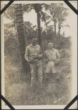 Kiwi soldiers holding coconuts in New Caledonia