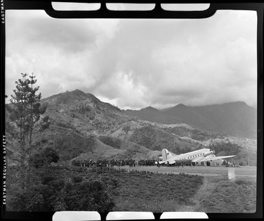 Qantas Empire Airways aircraft VH-EAP, on airstrip at Kerowagi, Papua New Guinea