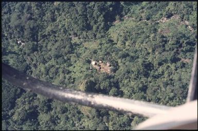Aerial view of villages (2) : Helicopter flight, Bougainville Island, Papua New Guinea, 1971 / Terence and Margaret Spencer