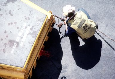 A flight deck crewman aboard the amphibious assault ship USS SAIPAN (LHA-2) prepares for flight deck operations. The SAIPAN is taking part in exercise Ocean Venture '81