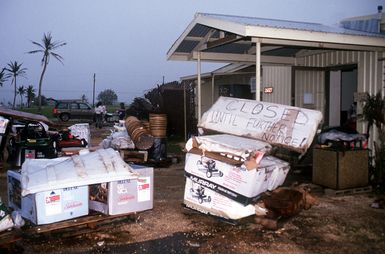 Equipment and appliances are stacked outside the damaged Four Seasons Store in the aftermath of Typhoon Omar. The storm struck on August 29th, causing severe damage to Andersen; Naval Station, Guam; and the surrounding area