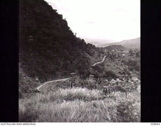 DONADABU, NEW GUINEA. 1943-11-07. VIEW OF THE ROUNA FALLS ROAD WINDING UP THE MOUNTAINSIDE