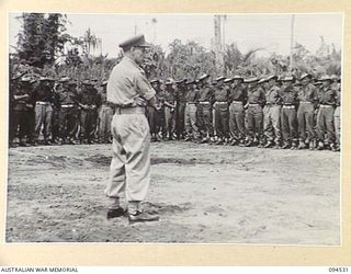 CAPE WOM, WEWAK, NEW GUINEA, 1945-07-29. MAJOR-GENERAL J.E.S. STEVENS, GENERAL OFFICER COMMANDING 6 DIVISION, AT 6 DIVISION RECEPTION CAMP, ADDRESSING 6 DIVISION TROOPS WHO ARE GOING HOME FOR ..