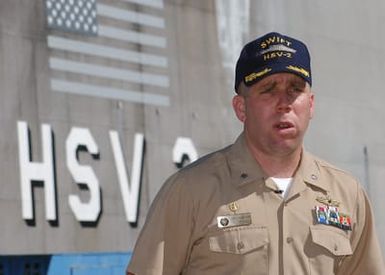 US Navy (USN) Commander (CDR) Mark Sakaguchi, Commanding Officer of the USN High Speed Vessel Two (HSV 2) SWIFT, speaks to media during a brief port visit at Naval Base Pearl Harbor, Hawaii (HI), prior to deploying to Southeast Asia to provide assistance to victims of the devastating Tsunami that hit the region in support of Operation UNIFIED ASSISTANCE